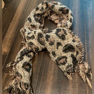 Sequined animal print scarf or wrap.